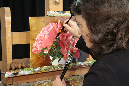 Photograph of Ann Trusty Painting a Floral in Oil
