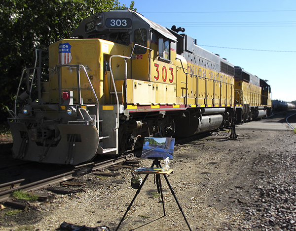 Photo of Freight Train and Artist Easel