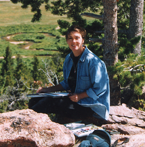 Photograph of Ann Trusty painting in Rocky Mountain National Park